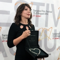Tinatin Kajrishvili - Director of the film BRIDES, receiving the award for Mari Kitia - Actress of the film BRIDES - Heart of Sarajevo for Best Actress Award, Sarajevo Film Festival, 2014 (C) Obala Art Centar