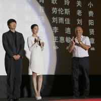 Yi'nan Diao - Director of the film BLACK COAL, THIN ICE, and Lun Mei Gwei - Actress of the film BLACK COAL, THIN ICE, with Mirsad Purivatra - Director of the Sarajevo Film Festival, greeting the audience after screening, HT Eronet Open Air Cinema, Sarajevo Film Festival, 2014 (C) Obala Art Centar